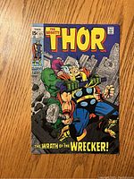 Front cover of The Mighty Thor comic book #171 showing Thor and the Wrecker in a fight scene with city background and comic title at top.