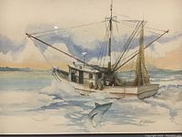 Close-up of the watercolor painting showing the fishing boat, dolphin, and artist's signature.
