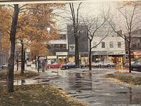 Close-up photo of the street scene artwork showing autumn trees, road, parked cars, and storefronts including 'LE MARCHÉ aux HOMMES' and 'HARRODS',' framed behind glass
