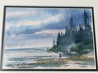Close-up of watercolor painting showcasing the coastal landscape with an angler near the water and tree line in the background, signed by artist L. Brimacombe.