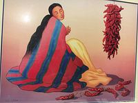 Close-up of lithograph image showing woman wrapped in colorful striped blanket next to red chili peppers, with pencil signature visible