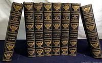 Eight hardcover volumes of 'Messages and Papers of the Presidents' arranged upright, showing spines with gilded volume numbers and eagle insignia.