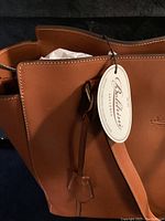 Close-up of the top corner with attached leather tag showing the Boldrini Selleria label.