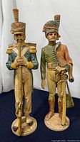 Side view of two Italian soldier figurines, showing detailed uniforms and face expressions.