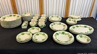 Full set of vintage Franciscans Ivy Collection dinnerware displayed on table showing various plates, bowls, saucers and butter dish top.