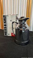Photo showing the carafe alongside its original box displaying branding HEISS & KALT and ALFI.