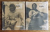 Two unopened sets of archival photo prints featuring Inuit and Dene Traditional Life Series from Northwest Territories, still wrapped in original cellophane.