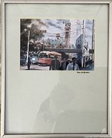 Framed watercolour painting showing Toronto street scene and signed by artist Nell LaMarsh.
