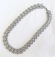Full view of the wide vintage silver chain collar necklace laid flat showing the entire length and link design.