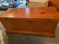 Front view of the pine blanket box showing wood grain and finish