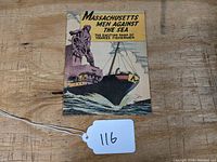 Cover of Massachusetts Men Against the Sea comic book depicting a ship and a ship's wheel on the front.