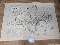 Full view of the 1722 map reproduction showing the town layout of Boston including streets, common areas, and surrounding waters with ships.