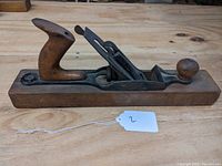 Top side view of the Sargent No. 3416 hand plane showing wooden rear handle, flat wooden sole, and metal blade assembly in the center.