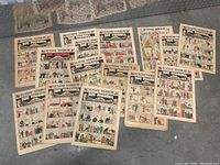 Full spread showing 14 original Joe Palooka comic sections laid out on surface, displaying the Sunday Mirror header and colorful comic panels.