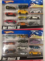 Two sealed Hot Wheels 10-car collector sets in packaging with various car designs.