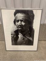 Full view of framed black and white Jimi Hendrix portrait showing the entire artwork and frame.