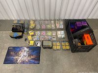 Wide overhead view of Elite Trainer Box, mixed cards and crate of empty boxes
