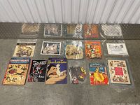 Overview photo showing all Disney and Dr. Seuss ephemera laid out on the floor in protective sleeves.