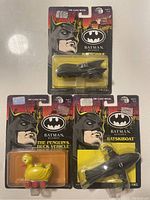 Photo of all three Batman Returns diecast metal vehicles in original packaging: Batmobile, The Penguin's Duck Vehicle, and Batskiboat