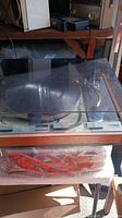 Front view showing Thorens turntable with dust cover closed and Uher recorder below