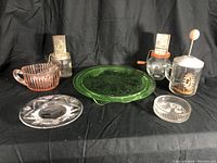 Overview photo showing all six vintage kitchen glass items on a black cloth background