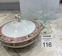 Photo displaying an antique covered china casserole with a floral pink and gold border and a Bohemia Crystal raised serving bowl with pedestal base.