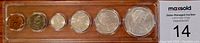 Top-down view of the 1966 Canadian coin set in original brown case with transparent cover, showing all six coins arranged in a single row from penny to silver dollar.