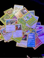 Spread of Pokémon cards including Staravia, Dewott, Gloom, and more in variation of shadowless and uncommon varieties.