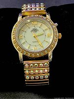 Front view of Kirks Folly Vintage Women's Watch with rhinestone bezel and decorated expandable band.