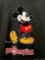 Close-up of Mickey Mouse graphic and Walt Disney World logo on black sweatshirt