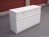 Front and angled view of white painted 6 drawer mid century dresser showing overall design, drawer layout, curved top drawers, and hardware.