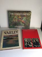 Photo of three Canadian art books on a white surface: 'The Tangled Garden', 'Varley', and 'Karsh Canadian 78'.
