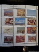 Full sheet of 12 Canadian postage stamps from 1982 Canada Day celebration displaying various Canadian scenes in art form, unused condition.