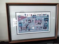 Full view of the professionally framed folk art print depicting a fall scene with folk art style figures, trees, and buildings.