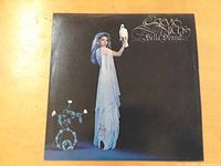 Front cover of the vinyl LP album showing Stevie Nicks in a white dress holding a white bird against a black background, with the album title 'Bella Donna' and artist name in decorative script.