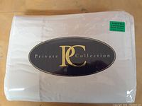 Packaged white quilt cover labeled Private Collection