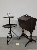 Sewing box and two-tiered tray displayed side by side on floor