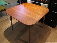 Front three-quarter view of table closed at 35.5" square
