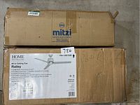 Box of Home Decorators Railey 60-inch ceiling fan with fan specifications visible on side
