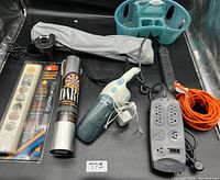 Overview of all lot items including pump, vacuum, yoga mat, shower caddy, hangers, power strips and extension cord.
