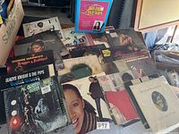 Overview of vinyl record collection showing multiple albums including Dionne Warwick, Gladys Knight & The Pips, Al Green (sealed)