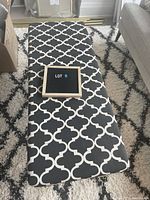 Top-down view showing the Moroccan black and white patterned upholstery on the bench.