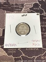 Top side of the 1912 Newfoundland silver 10 cents coin showing denomination and year.