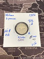 Front side photo showing the denomination '3 Pence', details about silver content 50%, year 1926, Type II, and condition VF noted on paper holder.