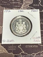 Photo of the obverse side showing the 1996 Canadian silver proof 50 cent coin with the coat of arms.