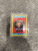 Front view of vintage ALF Season 1 Topps trading card set in protective case showing box label with ALF image and set details.