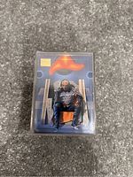 Close-up front view of a plastic case containing Skybox Master Series trading cards featuring artwork of a character sitting on a throne with a bright orange-red shape above.
