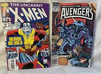 Photo of The Uncanny X-Men #302 and The Avengers #321 comic books placed side by side showing full covers.