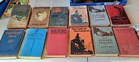 Full view of 10 hardcover Zane Grey western books displayed side by side, showing various cover colors and titles.