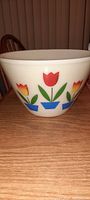Side view showing the tulip design pattern on white milk glass mixing bowl